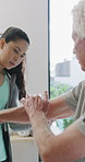 Physiotherapy, woman and senior man with arm pain, help and rehabilitation for injury recovery. Physical therapy, clinic and elderly patient in consultation for healthcare, healing or wellness