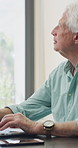 Thinking, laptop and mature man in home office, planning or remote work for investment project. Freelancer, idea or person typing on computer in house for financial email, decision or problem solving