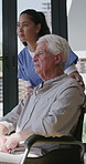 Support, nurse or old man with wheelchair by window for thinking, comfort or talking for senior care. Empathy, caregiver or elderly person with disability in nursing home, conversation or reflection