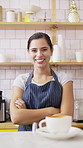Happy woman, face and barista with coffee in cafe for serving, hospitality or catering. Portrait, female person or espresso artist with smile, arms crossed or confidence for latte or cappuccino