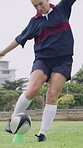 Rugby ball, woman and player on field with kick, start game and match in competition. Sport, person and football on tee for challenge, score conversion and accuracy practice with fitness on grass
