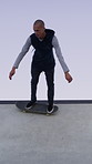 Man, skating and fun with skateboard outdoor for fitness, exercise and practice tricks. Space, male skater and freestyle for stunt performance, endurance training and extreme sports for weekend hobby
