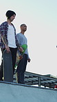 Men, ramp and action with skateboard for exercise, extreme sports and practice with friends. Skateboarder, training and group at skatepark for competition, hobby and balance outdoor with blue sky