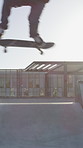 Legs, jump and training with skateboard in city, active and athlete with skill development or hobby. Outdoor, skater and person with tricks for extreme sport, performance and practice for competition