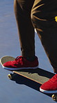 Skateboarding, trick and legs on court with action, stability control and riding technique in fitness hobby. Jump, skater or man with board, mobility performance and balance skills in Los Angeles.
