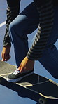 Shoes, skateboard and kickturn on ramp with friends, tricks and balance with riding at urban park. Person, skater and extreme sports in city with legs, practice and spin with training in summer