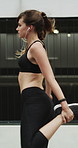 Fitness, earphones and warm up with woman in city for streaming service, health podcast and cardio. Wellness, exercise playlist and training music with person outdoor for runner, stretching and radio