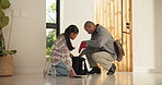 Dad, student and packing with bag in home for assistance, preparation or back to school. Father, helping or daughter getting ready with books, snacks or stationery for education or leaving house