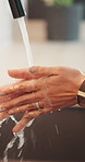 Health, water or person in home with hand washing, bacteria removal or sanitation in wellness routine. Safety, cleansing or woman with stream, germ protection or hygiene habit in virus prevention.