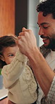 Father, dancing and holding hands with child at house for love, playful fun and bonding together. Smile, man and swaying with toddler for rhythm, emotional connection and family support for movement