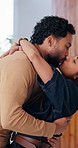Excited, hug and kiss with couple in new home together for celebration of loan or mortgage approval. Investment, real estate and success with happy people in apartment for property relocation