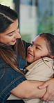Hug, laughing and woman with daughter in home together for connection, bonding or support. Funny, love and security with mother embracing girl child in apartment for family care, safety or trust 