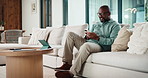Sneaky, man and typing in home with phone, social media and check dating website after wife leave. Mature, black person and smile with tech, secret relationship and text for online cheating affair.