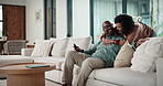 Couple, watching tv and hug on sofa with smile, bonding and surprise with love in living room. Mature man, woman and embrace with movies, television or film subscription on couch in lounge at house