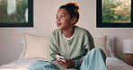 Sad, child and thinking with phone on bed for cyberbullying, self doubt and overthinking in home. Mental health, kid or unhappy with mobile in bedroom for online harassment, gossip shame or isolation