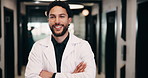 Face, man and doctor with arms crossed for healthcare, confidence and wellness career in hallway. Smile, physician or medical professional with portrait for about us, management and support in clinic