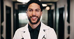 Face, man and doctor with smile for healthcare, confidence and wellness career in hallway. Pride, physician or medical professional with portrait for about us, management and support in clinic