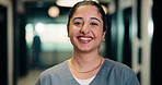 Happy, woman and face of nurse in hospital with confidence for medical career with service. Smile, professional and portrait of female healthcare worker with pride for about us in clinic hallway.