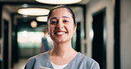 Smile, woman and face of nurse in hospital with confidence for medical career with service. Happy, professional and portrait of female healthcare worker with pride for about us in clinic hallway.