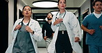 Doctors, running and panic in hospital with medical emergency, urgent patient crisis and ICU alert. People, rush together and healthcare team in hallway with worry, accident and hurry to save victim.