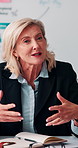 Meeting, paperwork and businesswoman with discussion in office, budget planning and annual forecasting. Talking, staff and mature advisor with revenue projection for proposal, asset review and smile