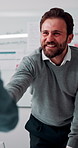 Meeting, handshake or businessman with client in office, investment contract or financial partnership. Deal negotiation, b2b or employees shaking hands for agreement, smile or venture collaboration
