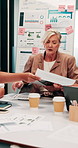 Woman, planning or meeting with paperwork for analyst, brainstorming or graphs in office. Mature person, project management and proposal with documents for discussion, stats or review for team