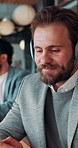 Headphones, phone and business man in office for text message, online music or thinking of response. Audio, smile and employee in workplace with mobile for typing, chat idea and streaming radio