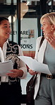 Business, documents and women walking for discussion, recruitment advice or planning. Human resources, people or mature manager with feedback, paperwork or talking of team schedule or agenda