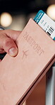 Hands, passport and person with ticket for flight, international travel or immigration in airport. ID, document and tourist with boarding pass for trip, vacation or holiday with booking details