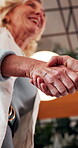 Realtor, happy or people in office with handshake, intro or deal closed in agreement. Meeting, below or real estate agents with shaking hands, property exchange or success in investment negotiation.