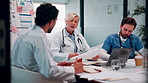Doctor, team and talk in hospital with documents, medical staff turnover and stats for mortality rate. Healthcare, people and meeting in clinic with paperwork, data and graphs for employee retention.