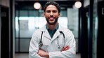 Crossed arms, man and face of doctor in hospital with confidence for career in medical service. Professional, happy and portrait of male healthcare worker with smile for pride in clinic with about us