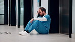 Healthcare, surgeon and man with stress in hospital, reflection and overwhelmed by difficult surgery. Unhappy, doctor and person with burnout after operation mistake, thinking and exhausted in clinic