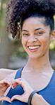 Fitness, face and happy woman with heart hands for love health or wellness in outdoor park. Portrait, active or female person with smile, like emoji or shape for healthcare, stamina or endurance