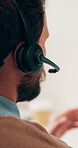 Headset, man and call center for communication, customer service or online solution with back. Consultant, tech and person talking for virtual discussion, contact us or questions for website support
