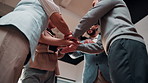 Success, team and stack with applause in office for winning pitch, deal closure and investment. Celebration, happy people and huddle with hands together for funding approval, clapping and low angle