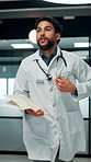 Running, doctor and man with paperwork in hospital, patient crash and results for urgent diagnosis. Reading report, critical info or person with medical support for crisis, rush or emergency response