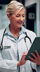 Reading, doctor or woman with tablet in hospital, medical journal or email for healthcare newsletter. Review, research and mature gp with ebook on clinical diagnosis, tech and smile for telehealth