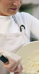 Bakery, mixing and dough with woman in kitchen for hospitality, flour ingredients and culinary. Pastry chef, cooking and sourdough bread with person in cafe for restaurant catering and baking