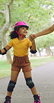 Rollerskate, holding hands and mom with child in park for bonding with activity, hobby and learning on weekend. Family, happy and mother with girl for skating, balance and practice together outdoor