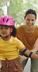 Rollerskate, happy and mom support for child with outdoor fun, learning and bonding in park. Teaching, playing and woman with girl for helping, practice and hobby with balance, patience and care