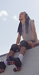 Calm, roller skates or black man with headphones at park, streaming music or breath for practice break. Training pause, rest or happy person with audio tech for playlist, below or sunshine on ramp