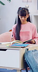 Homework, writing or teenager in house with thinking, learning activity or assignment insight on biology. Education, answer or girl with textbook, quiz notes or problem solving for science assessment