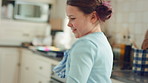 Dancing, child and happy with spin in kitchen for childhood freedom, fun movement and development. Growth, kid and energy with rhythm in house for self expression, weekend entertainment and wellness