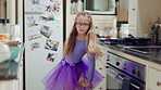 Child, dancing and tutu in home kitchen with energy, childhood and running with costume. Girl kid, happy dancer or ballerina with practice, play and fun with movement, adhd and glasses in house