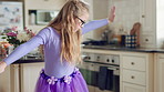 Child, home and dance with energy, ballet practice and creative performance with spin in kitchen. Girl, kid and moving as beginner ballerina in house, choreography and development with freedom