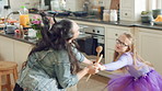Mom, child and dance in kitchen with energy, music or family bonding together for fun weekend break. Happy, woman and young daughter play in home with connection, holding hands and movement for song.