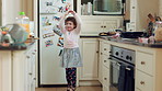 Dance, smile and child with spoon in kitchen for weekend fun, coordination and motor skill development. Home, utensil and girl with playful expression of happiness, ballet practice or moving to music