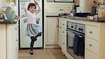Dancing, smile and kid with spoon in kitchen for weekend fun, childhood and motor skill development. Home, utensil and girl with playful expression of happiness, spin practice and movement for music